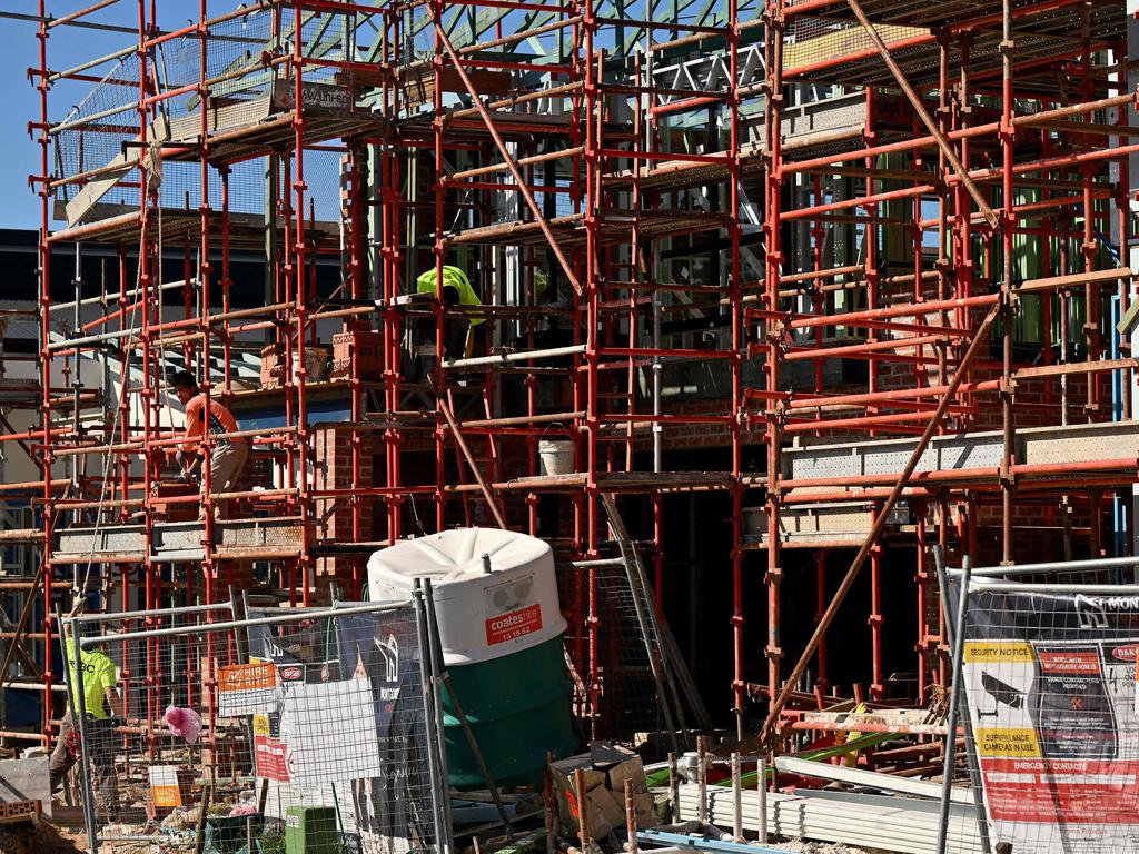 Labourers work on a house under construction in western Sydney. Picture: Saeed KHAN / AFP.