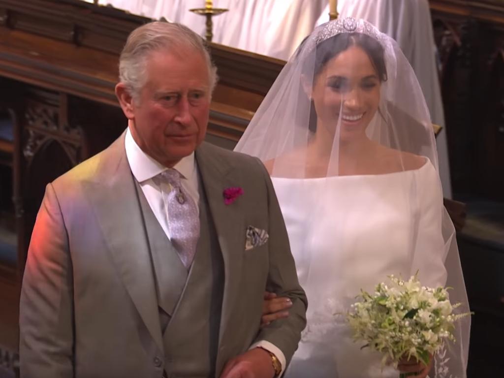 Prince Charles, Prince of Wales leads Meghan Markle up the aisle of St George's Chapel for the wedding ceremony. Picture: BBC