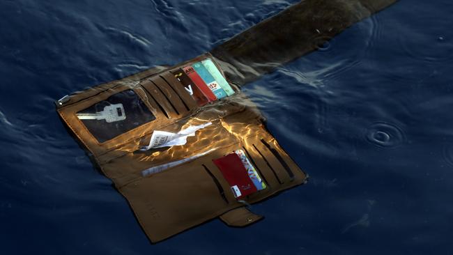 A wallet belonging to a victim of the Lion Air passenger jet that crashed floats in the waters of Ujung Karawang, West Java, Indonesia. Picture: AP