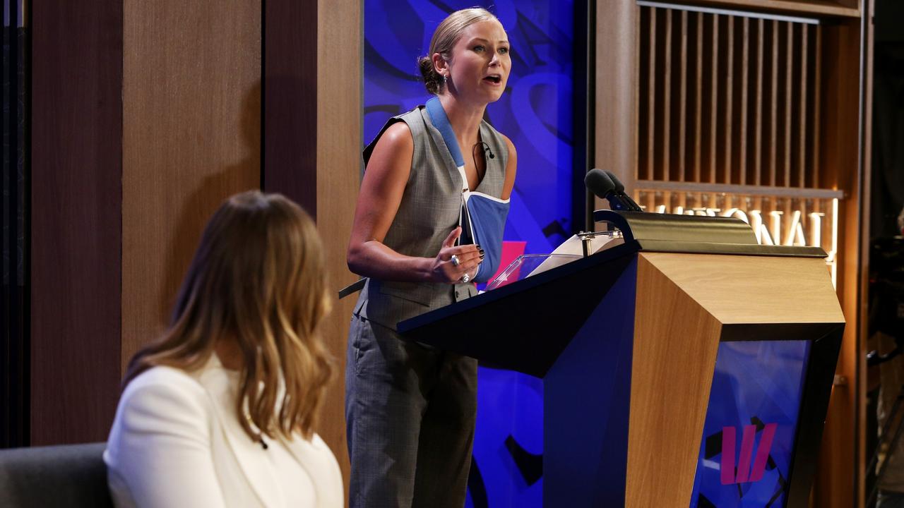 Tame addresses the media at the National Press Club as Brittany Higgins watches on. Picture: Lisa Maree Williams/Getty Images