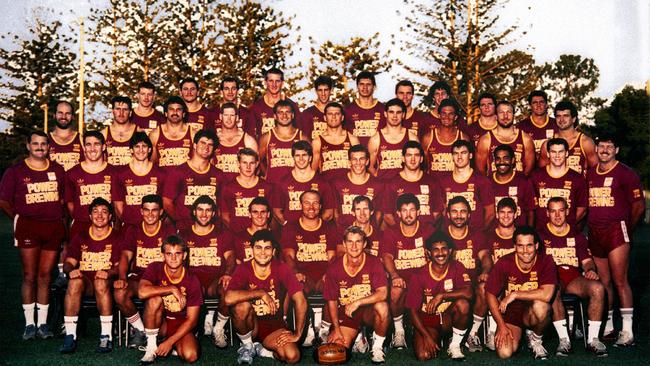 The Broncos of 1988: Backrow, left to right: Grant Rix, Tony Schafer, Scott Lewis, Andrew Tessmann, Peter Benson, Brad Foster, Craig Marshall, Dean Sammut, Alan Cann, G Thorogood. Third row: Mark Meskell, Michael Hancock, Colin Scott, Peter Sinclair, Terry Matterson, Brook Kennedy, Chris Johns, Brett Walters, Brad Tessmann, Greg Conescu. Second row: Darryl Brohman (reserve grade coach), Jason Hanrahan, David Bourke, Brett Plowman, John Plath, B Tengdahl, C Grauf, Ray Herring, G Manthey, Joe Kilroy, G Hogarth, Gene Miles. First row: Billy Noke, A Gee, Andrew McCarron, Rohan Teevan, Wally Lewis (cpt), Wayne Bennett (coach), Greg Dowling, Bryan Niebling, Keith Gee, Mark Hohn. Kneeling: Craig Teevan, Shane Duffy, Allan Langer, Gary French, Brett Le Man.