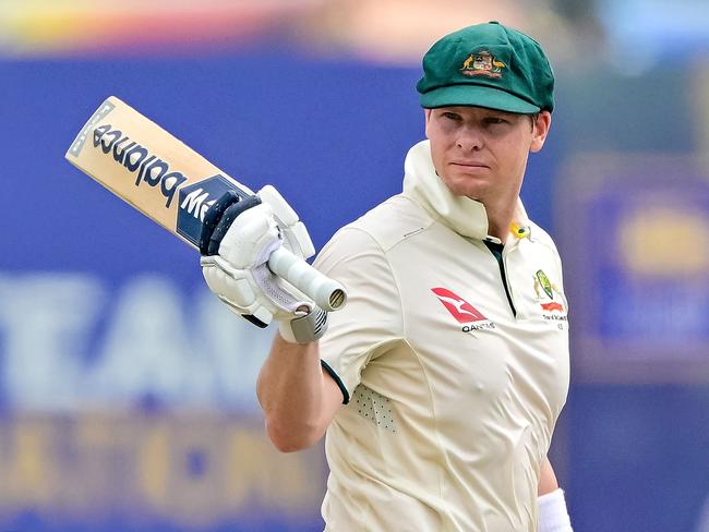 Australia's captain Steve Smith celebrates after scoring a half-century (50 runs) during the first day of the first Test cricket match between Sri Lanka and Australia at the Galle International Cricket Stadium in Galle on January 29, 2025. Skipper Steve Smith crossed a milestone 10,000 runs in Test cricket as Australia reached 145-2 at lunch on day one of the first match against Sri Lanka. (Photo by Ishara S. KODIKARA / AFP)