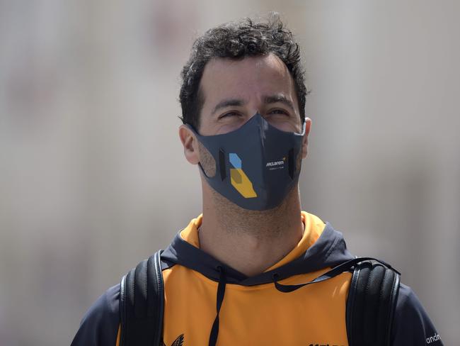 McLaren's Australian driver Daniel Ricciardo arrives ahead of the third practice session ahead of the Bahrain Formula One Grand Prix at the Bahrain International Circuit in the city of Sakhir on March 19, 2022. (Photo by Mazen Mahdi / AFP)