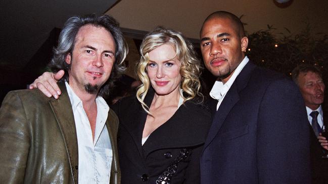 Actor Daryl Hannah flanked by unnamed men in 2003. Picture: Saffrine Nydegger