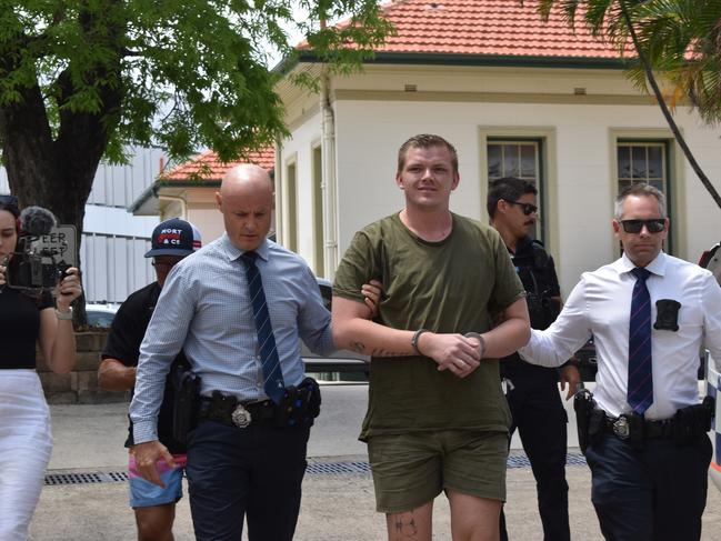 James George De Marco being walked to the Rockhampton Watch House on January 17 2024. He was charged with the alleged murder of Anuisha Bone.