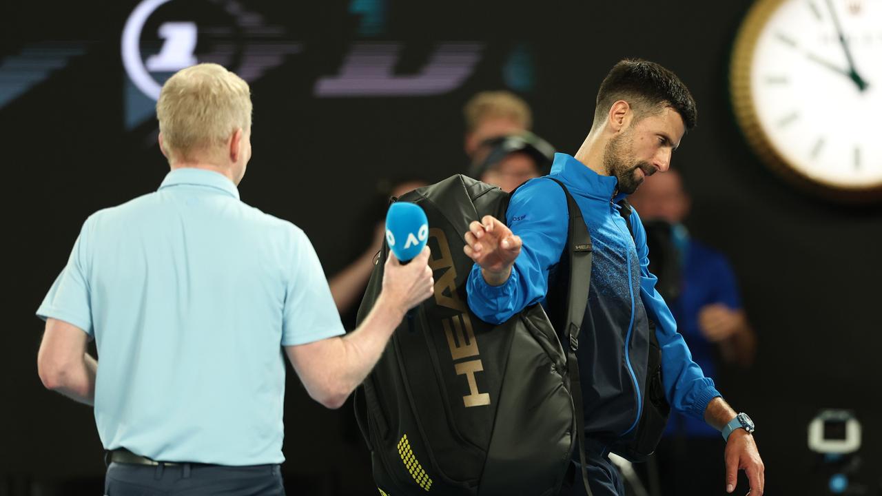 Novak Djokovic left Jim Courier hanging. Photo by Cameron Spencer/Getty Images.