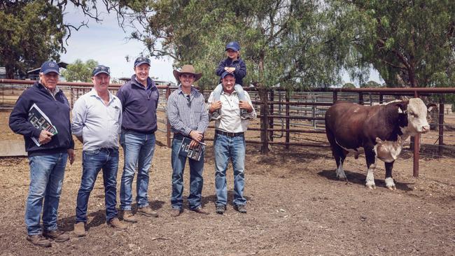 Antony Baillieu, Mick Petersen (cattle manager), Craig Brewin (Yarram Park manager), Hugh Spencer from Ironbark Herefords and Ruki Baillieu with son Archie (4).