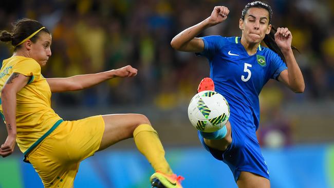 Brazil’s Thaisa challenges Chloe Logarzo for the ball.