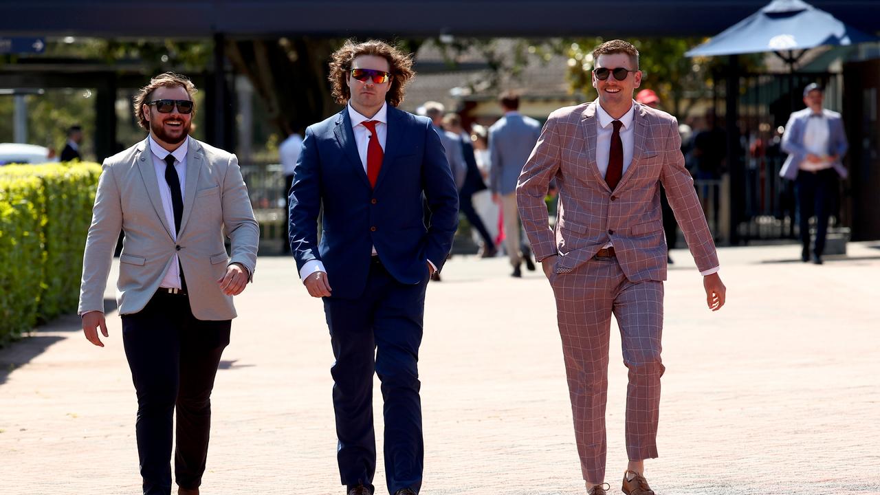 Racegoers in some of their finest suits. Picture: Jeremy Ng/Getty Images