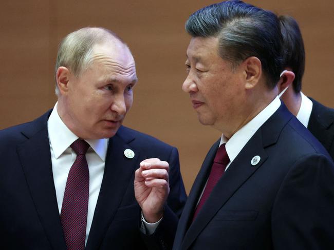 Vladimir Putin speaks to Xi Jinping during the Shanghai Cooperation Organisation (SCO) leaders' summit in Samarkand on September 16. Picture: AFP