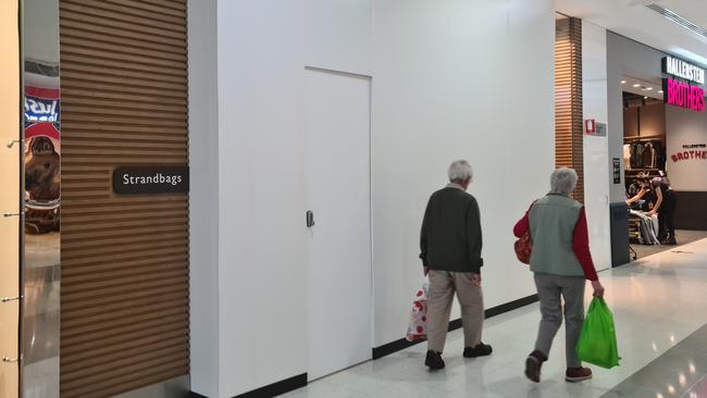 Hoarding erected outside the entrance to the Strandbags store in Westfield Garden City. Picture: Thomas Morgan