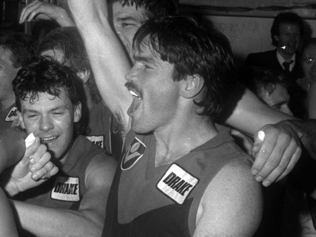 1987. Footscray v Melbourne. Western Oval. Jubilation in the Demon rooms after Melbourne scrapes into the finals for the first time since 1964.Sean Wight.Neg: 870829/193
