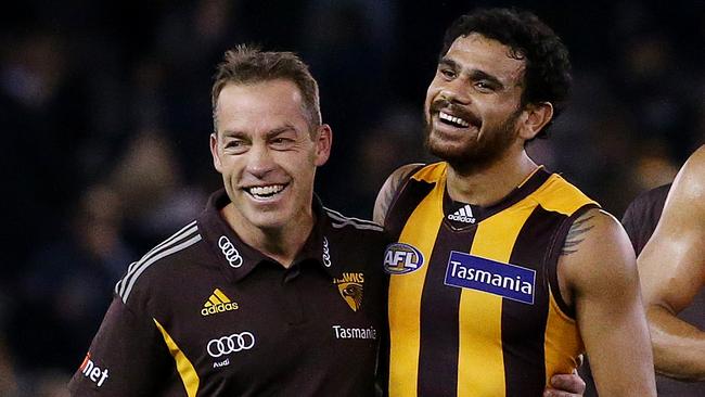 AFL - North Melbourne v Hawthorn at Etihad Stadium , Hawthorn's Cyril Rioli gets a hug from coach Alastair Clarkson after the win. 17th June 2016. Picture: Colleen Petch.