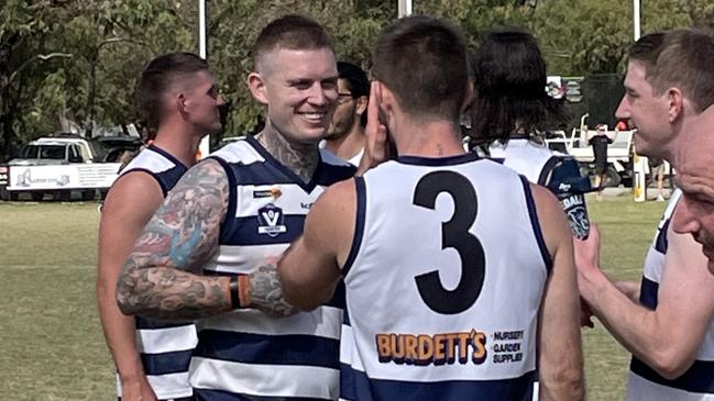 Dayne Beams has a laugh with Ryan Bastinac at quarter time.