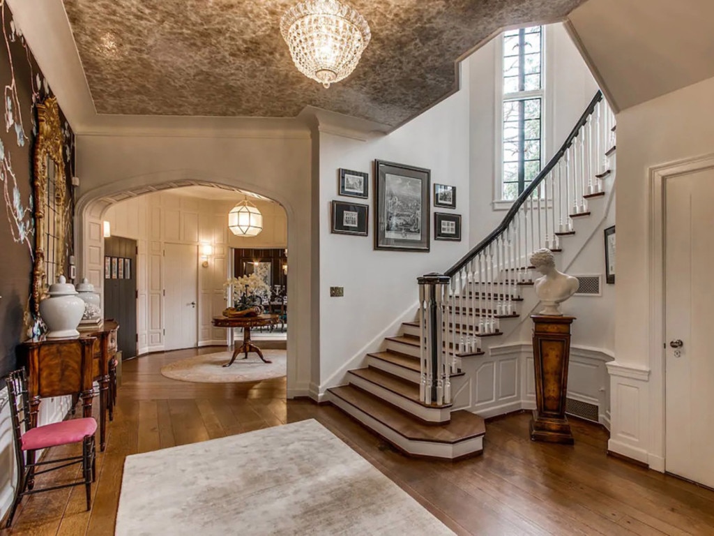 The base of the home’s winding staircase is pictured in this photo of the restored mansion. Picture: Realtor