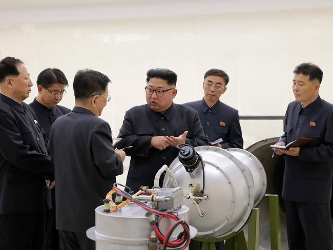 Kim Jong-un inspects the loading of a hydrogen bomb into a new intercontinental ballistic missile. Picture: Korean Central News Agency/Korea News Service via AP