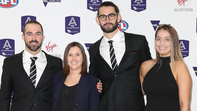 Steele Sidebottom of the Magpies and partner Alisha Edwards with Brodie Grundy and partner Rachel Wertheim during the 2018 AFL All-Australia Awards. Picture: Getty Images