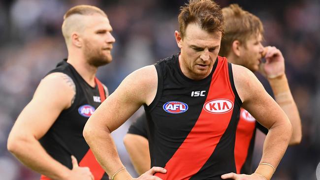 Jake Stringer, Brendon Goddard and Michael Hurley after the loss.