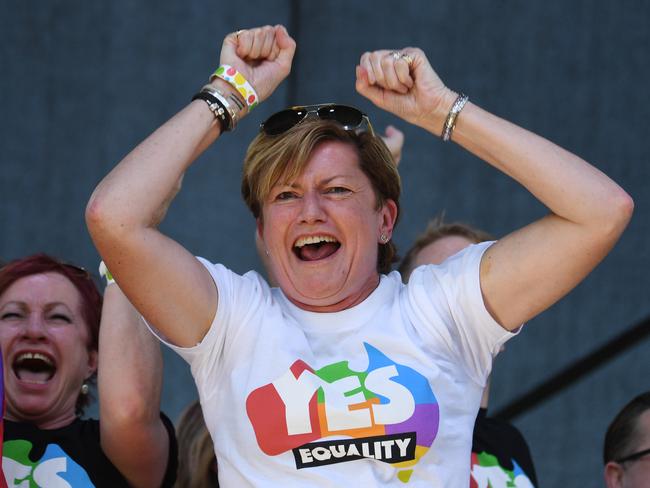 Christine Forster, the sister of former prime minister Tony Abbott, celebrates after watching the same sex marriage vote result announcement. Picture: AAP