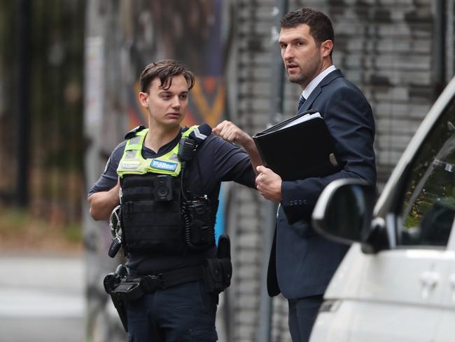 Police at the scene in Collingwood where two people were shot. Picture: David Crosling