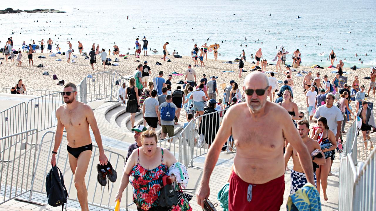 Large crowds leaving Coogee beach on Sunday. Picture: Adam Yip