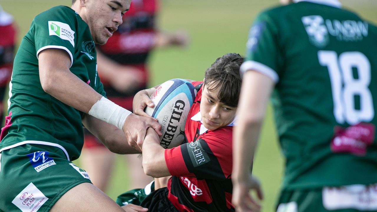 Makoto Chapman surrounded by opposition players.