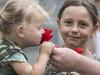 10/11/15 Evie 2 and Valentine 7 Costin (mum Naomi 0403592505) getting poppies from LCPL Zac Butler (0439885726) ahead of Remembrance Day, near the National War Memorial, Adelaide. Picture by Matt Turner.