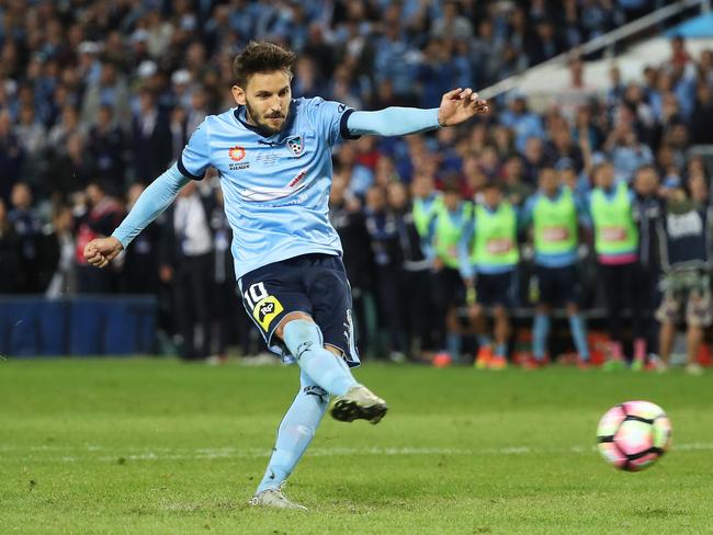 Ninkovic buries the winning penalty. Picture: Brett Costello