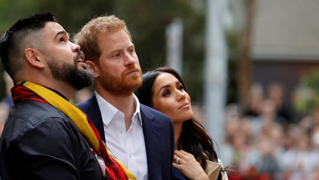 Harry and Meghan with Robert Young. Picture: Getty