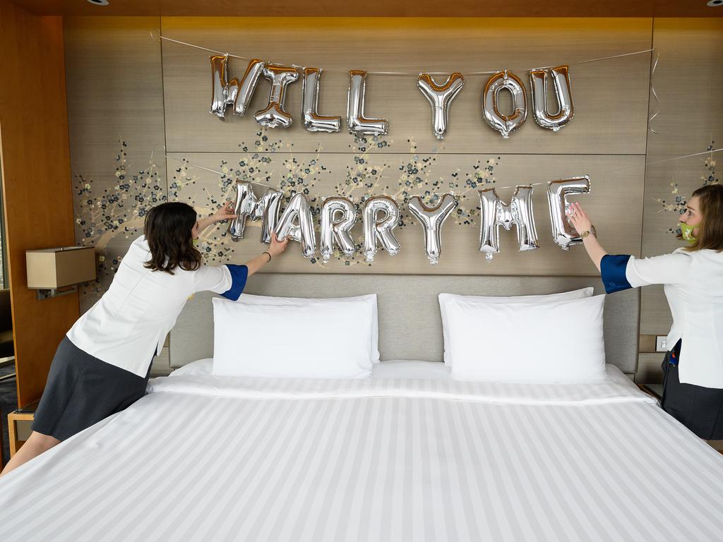 Two members of the guest relations team prepare a room for a wedding proposal at the Shangri-la Hotel in London as restrictions eased in the UK. Picture: Getty Images