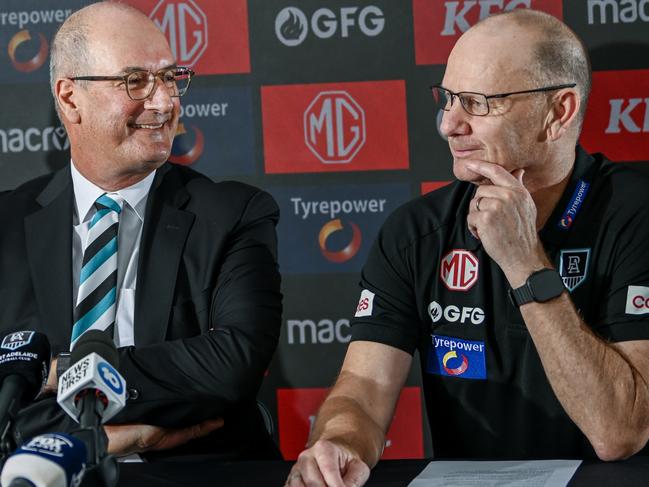 ADELAIDE, AUSTRALIA - FEBRUARY 12:Josh Carr senior assistant coach of Port Adelaide  ,Port Adelaide Football Club chairman David Koch and Ken Hinkley senior coach of Port Adelaide  speak to the media during a Port Adelaide Power AFL press conference at Alberton Oval on February 12, 2025 in Adelaide, Australia. (Photo by Mark Brake/Getty Images)