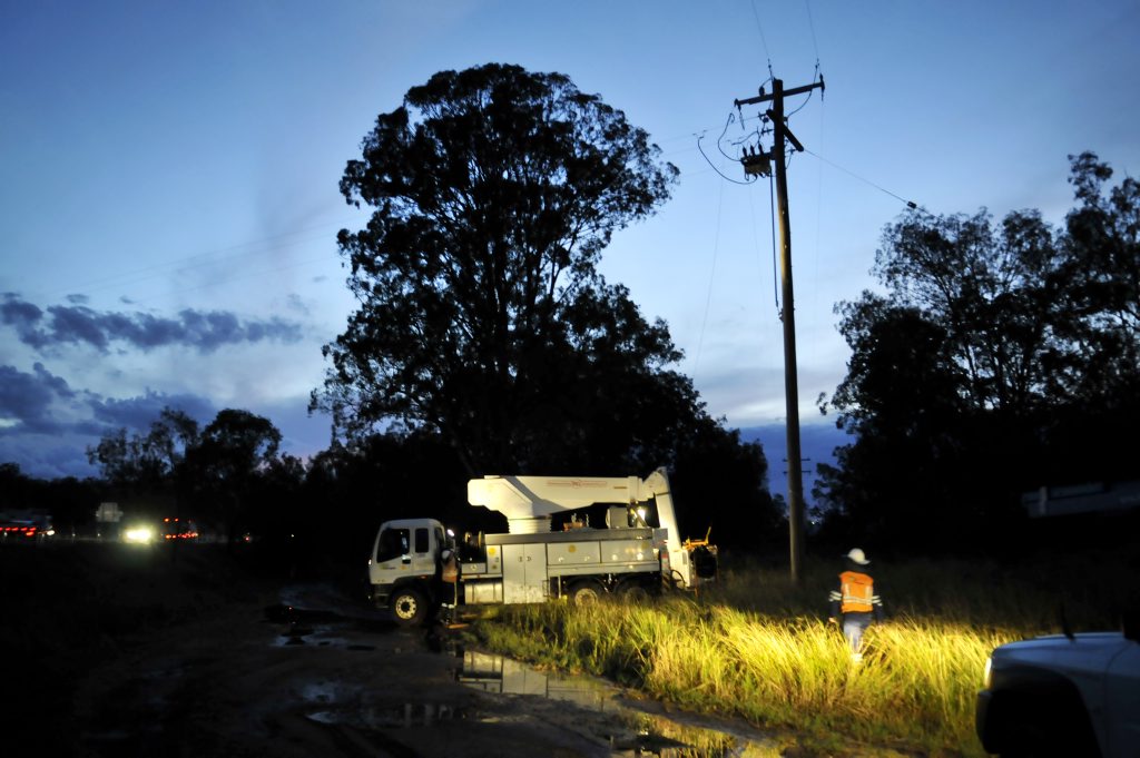 Energex crews attend power lines down across Warrego Hwy near Postmans Ridge. Photo Dave Noonan / The Chronicle. Picture: Dave Noonan