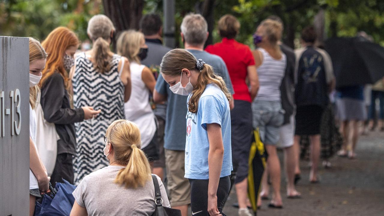 People pictured waiting in line at the pop-up COVID-19 clinic at Newport Community Centre last night. Picture: Monique Harmer.