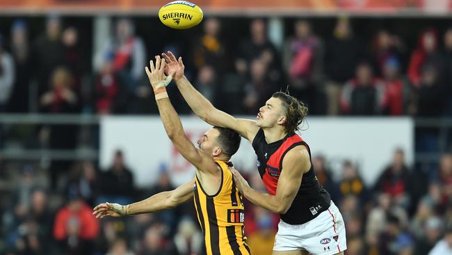 The Bomber’s Sam Draper wins a ruck contest during the match against Hawthorn at UTAS Stadium. Picture: Getty