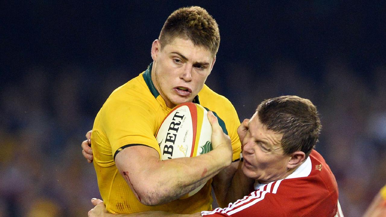 James O'Connor tackled by British and Irish Lions centre Brian O'Driscoll.