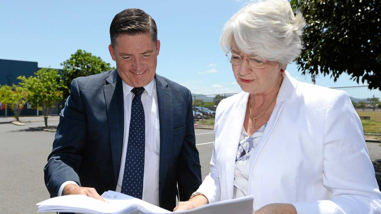 Aldi Property Director Brendan Geary with Mayor Margaret Stelow looking over plans for the Aldi store which is to be built next to Fantastic Furniture on Gladstone Road. Picture: Chris Ison ROK160217caldi2