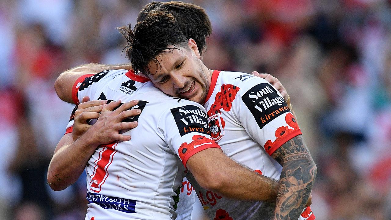 Ben Hunt of the Dragons celebrates with Gareth Widdop after scoring a try.