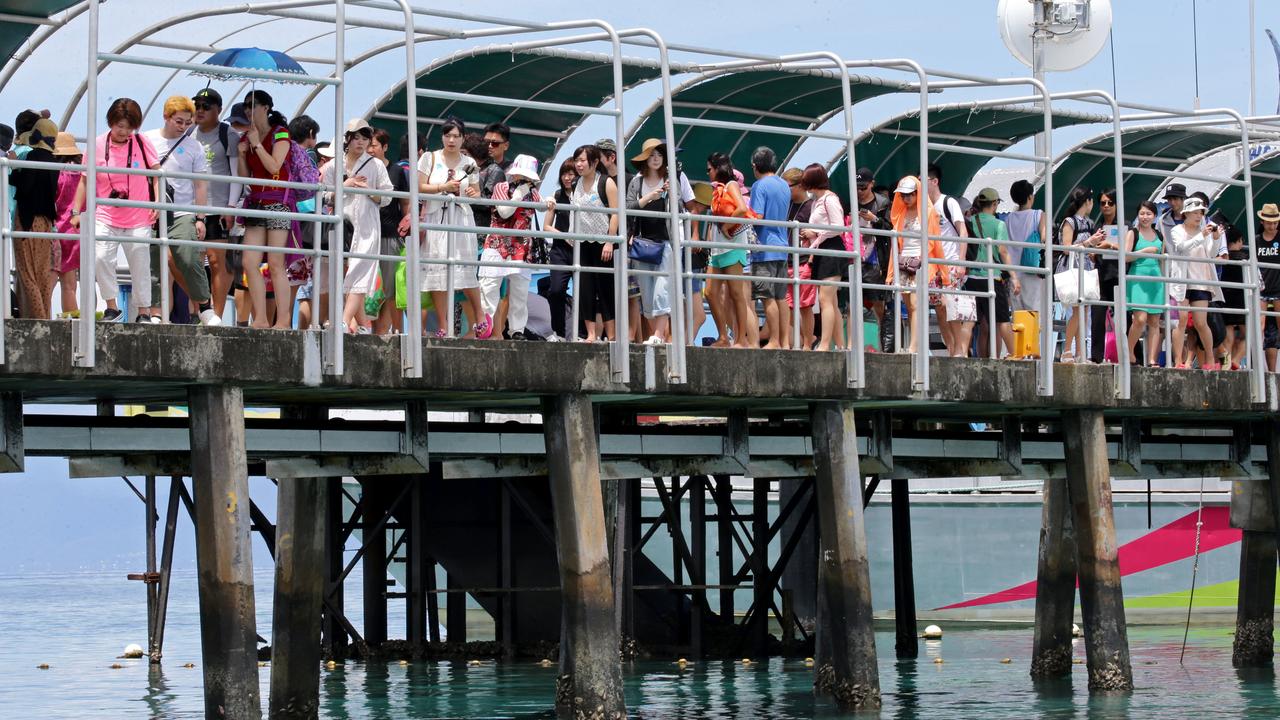 Hundreds of tourists arrive at Green Island. Picture: Anna Rogers