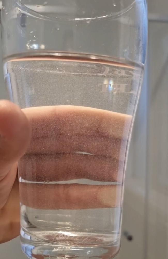 A glass of tap water at a South Ripley residence on June 7, 2024, with particles clearly visible in it.