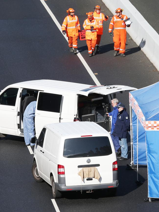 Police and emergency services search Mr Virgona’s van after the shooting. Picture: David Crosling