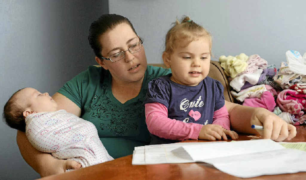 BALANCING THE BUDGET: Bernadette Dennis with her two daughters, Rachael, 4 months and Caitlyn, 2. Picture: Brenda Strong GLABUDG