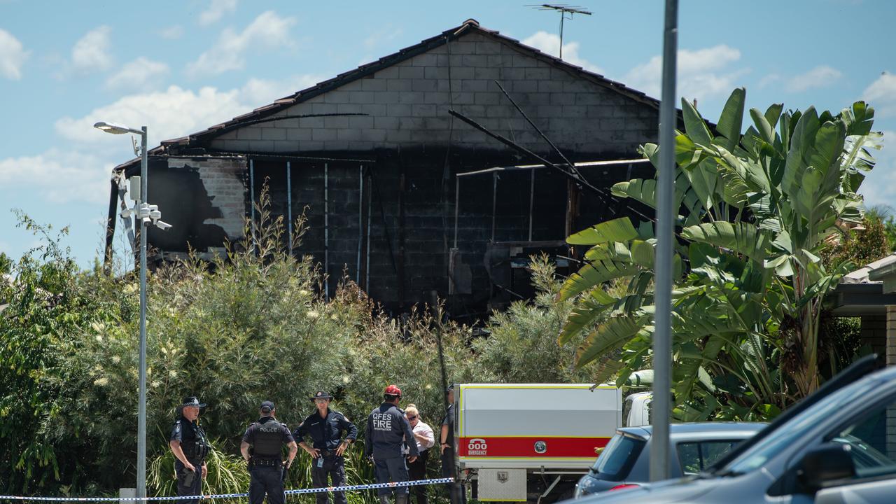 Firefighters and police outside the Browns Plains home. Picture: Brad Fleet