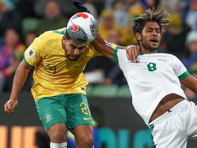 MELBOURNE , AUSTRALIA. November 15, 2023.  FIFA Mens World Cup Qualifier.  Australia vs Bangladesh at AAMI Park.  Massimo Luongo of the Socceroos and Mohammad Rabiul of Bangladesh        . Pic: Michael Klein