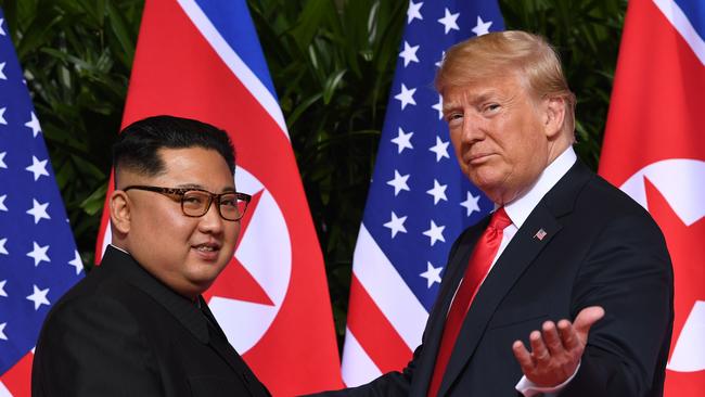 Kim Jong-un and Donald Trump meet for the first time in Singapore. Picture: AFP