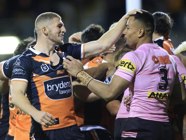SYDNEY, AUSTRALIA - JUNE 04: Adam Doueihi of the Tigers taunts Stephen Crichton of the Panthers after a Tigers try during the round 13 NRL match between the Wests Tigers and the Penrith Panthers at Leichhardt Oval, on June 04, 2021, in Sydney, Australia. (Photo by Mark Evans/Getty Images)
