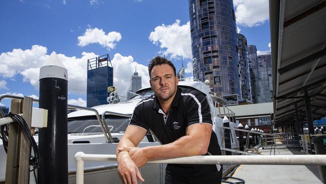 Bronson Norris, the owner of Party Boat Charters, pictured in front of one of his boats at Barrack Street Jetty in Perth. Picture: The West Australian / Ross Swanborough.