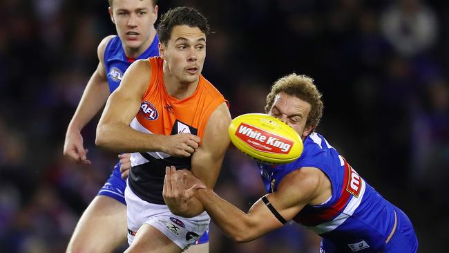 Josh Kelly gets a handball away against the Western Bulldogs. Picture: Michael Klein