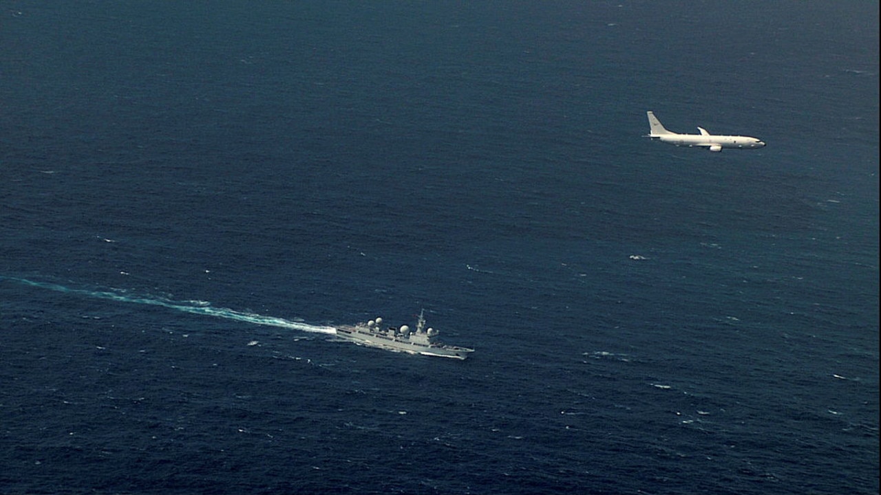 A Royal Australian Air Force P-8A Poseidon Maritime Patrol Aircraft passes a People's Liberation Army - Navy Dongdiao Class Auxiliary Intelligence Ship. Picture: ADF