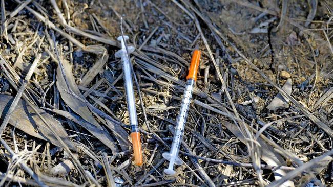 Gympie council workers found uncapped syringes in a local street recently. Picture: Paul Braven GLA160617NEEDLE