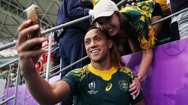 Christian Lealiifano poses for a selfie with fans.